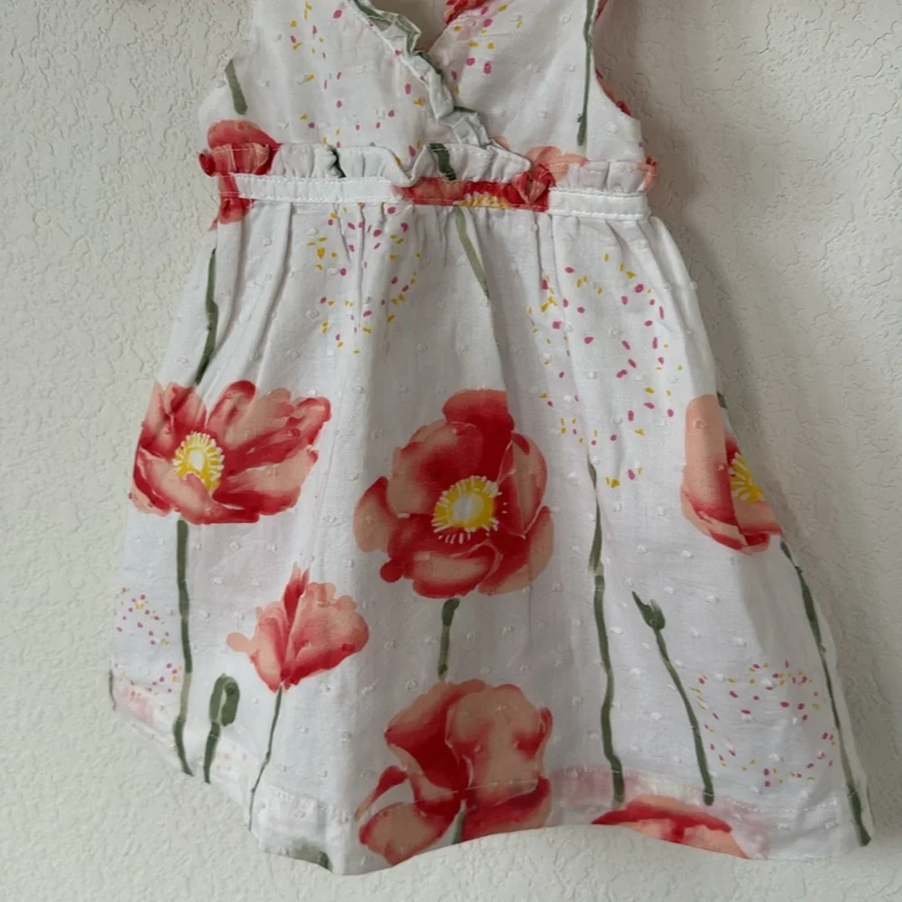 Penelope Mack • White Dress with Swiss Dots and Red & Green Floral Detailing